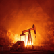 Flames from the Maria fire burn through an oil field in Santa Paula, California late on October 31, 2019.